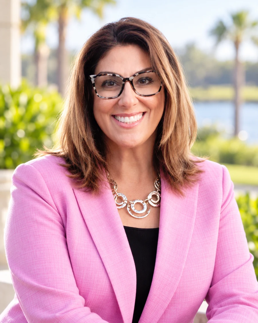 Ilona Fischer in a pink blazer, professional portrait
